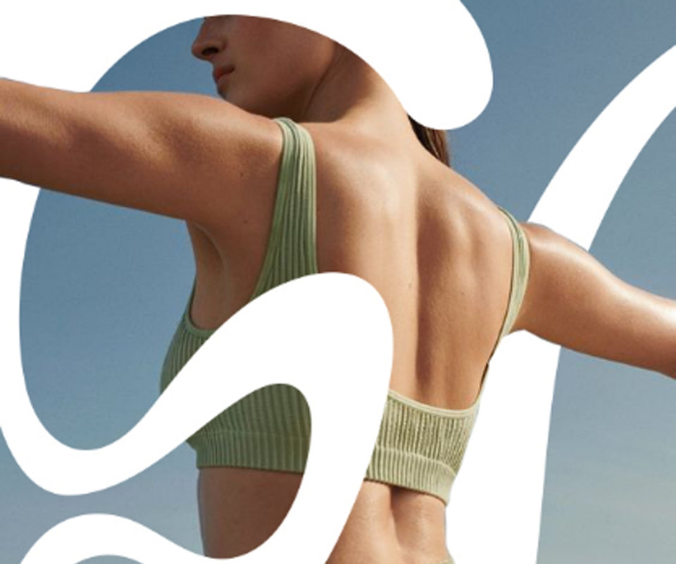 Confident woman stretching outdoors — symbolizing balance, vitality, and oxygen-powered movement with Elevate O₂.