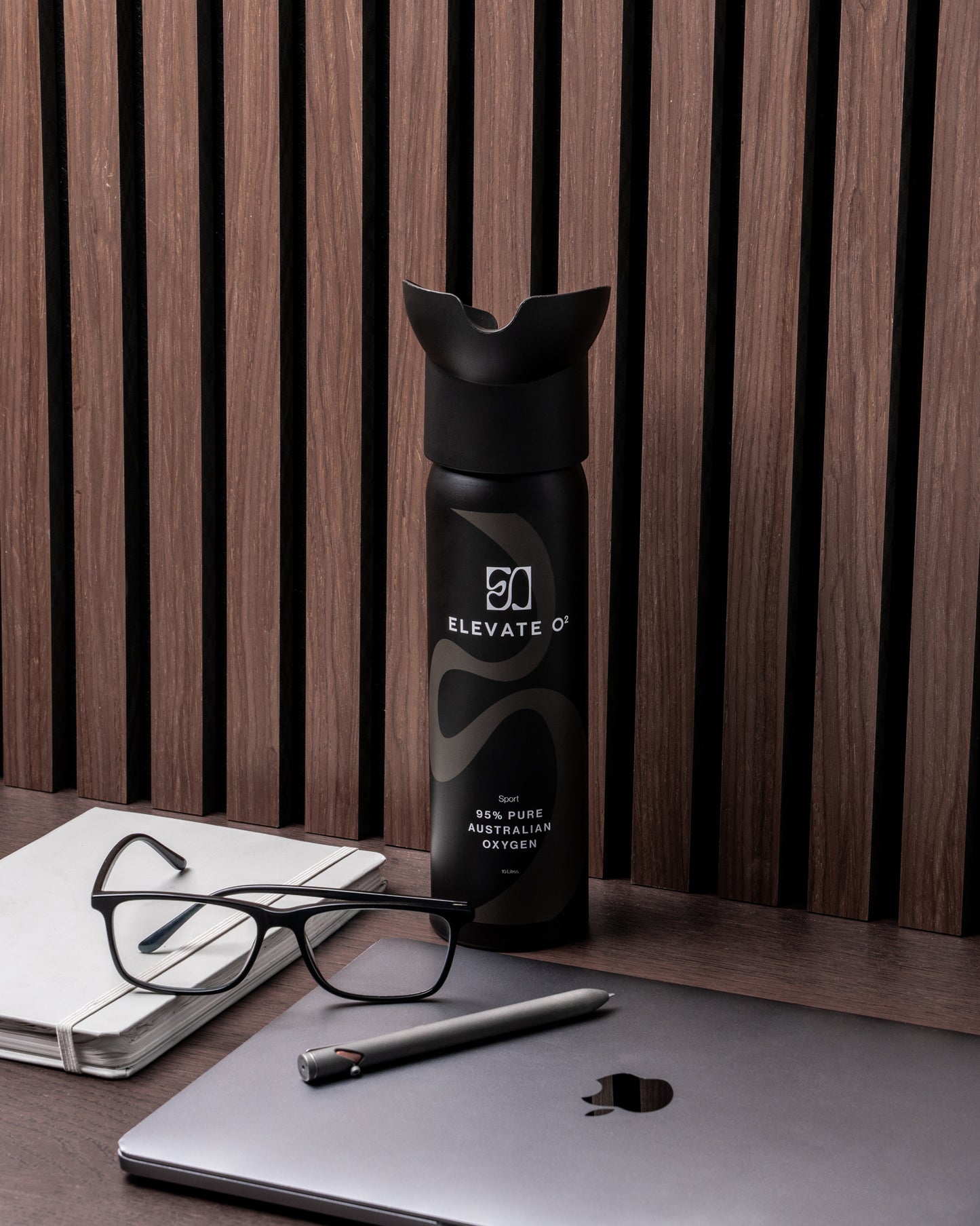 Elevate O₂ black and blue portable oxygen canisters — 95% pure Australian oxygen for performance, recovery, and wellness.