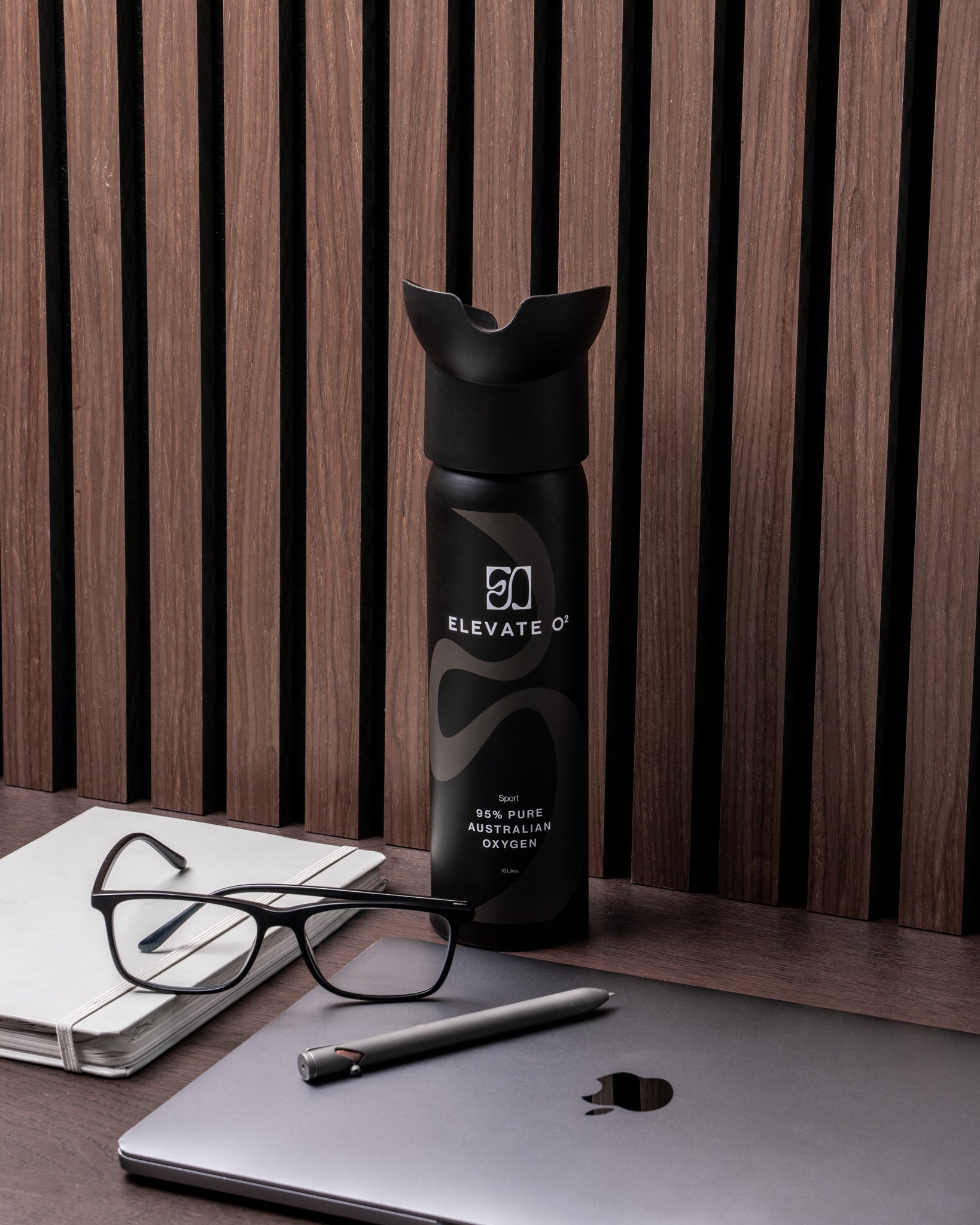 Elevate O₂ black and blue portable oxygen canisters — 95% pure Australian oxygen for performance, recovery, and wellness.